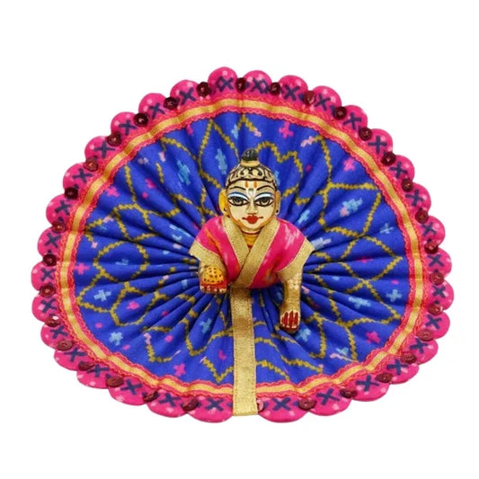 Decorative item with a figure in a pink outfit on a blue and pink circular background
